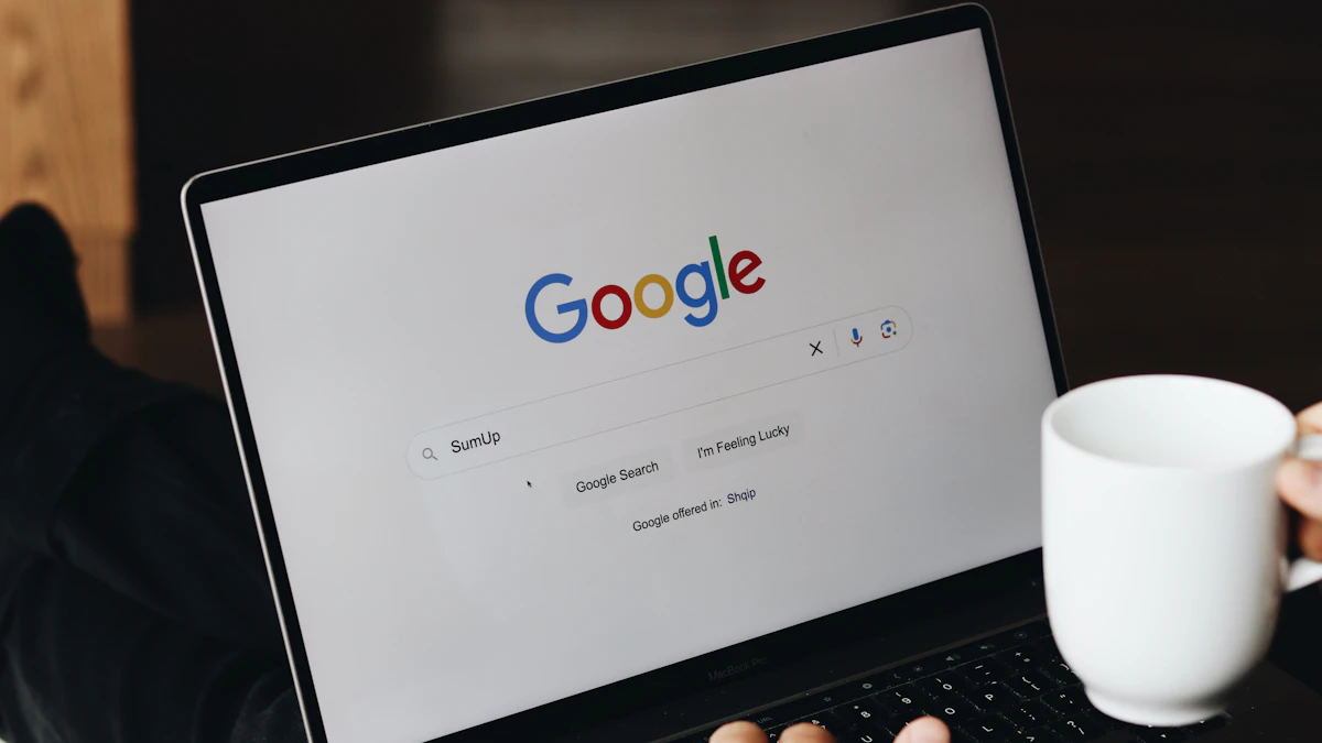 A person sitting in front of a laptop computer