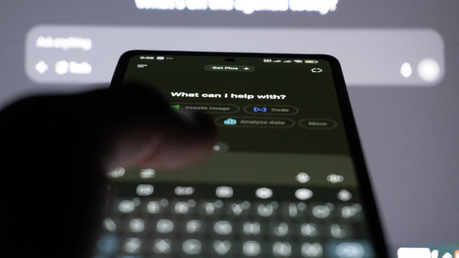 Person typing on smartphone with ai chatbot on screen